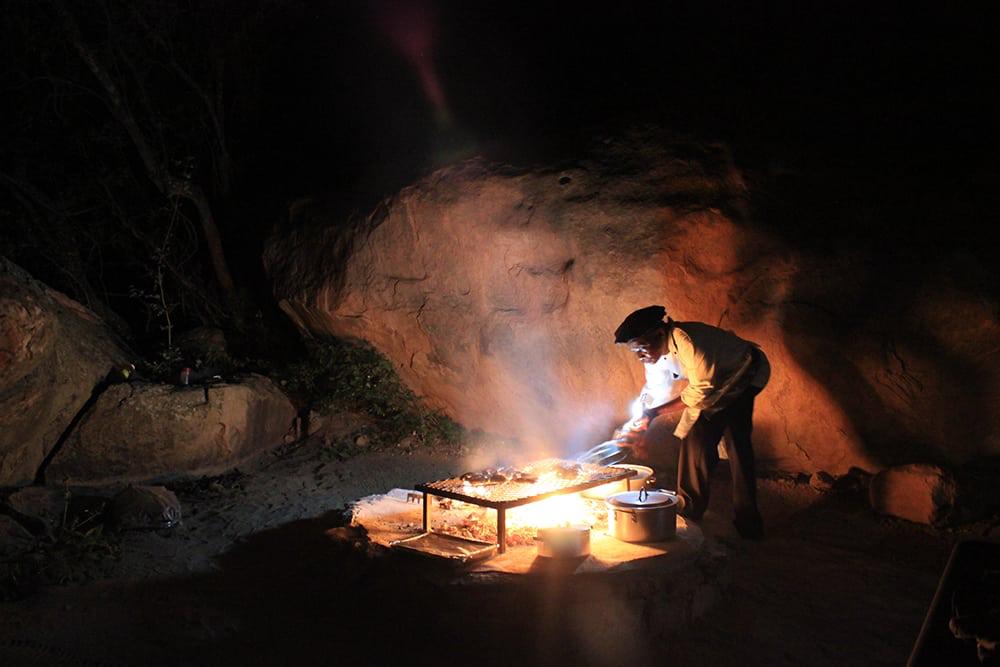Warm firelight in a stone shelter